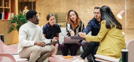 A marketing team having a project discussion at work